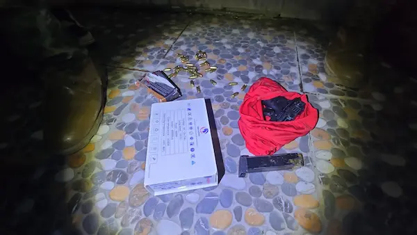 Arma de fuego y municiones decomisadas